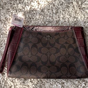 Brown and burgundy coach wristlet